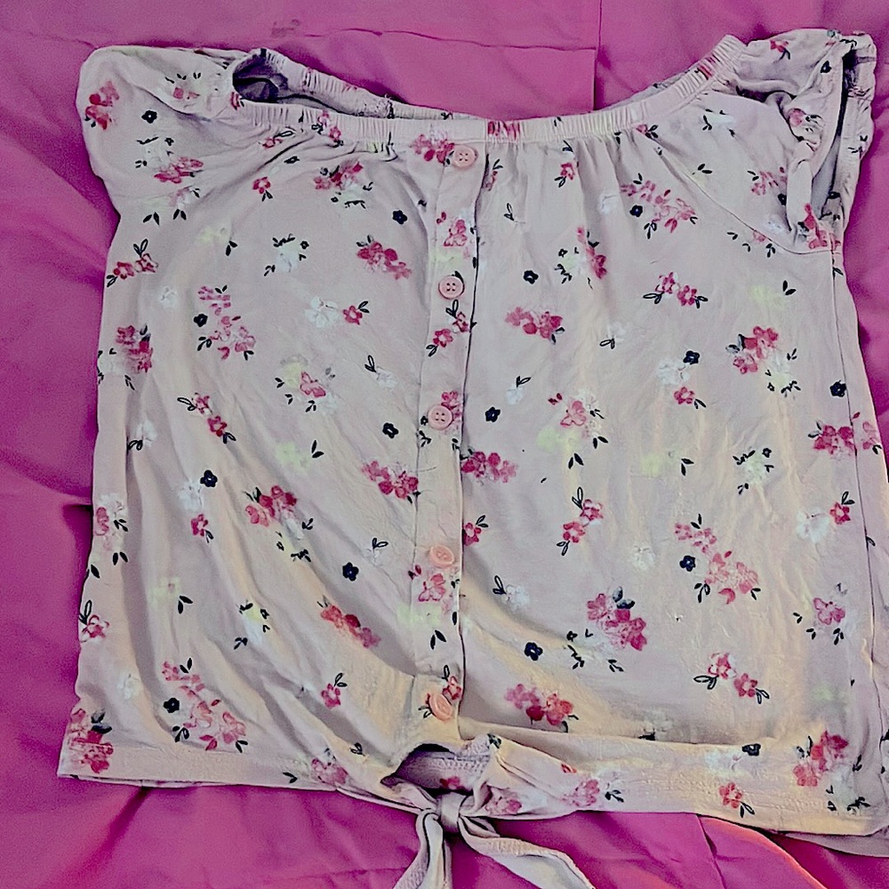 This is a pink floral button/tied short sleeve shirt for kids